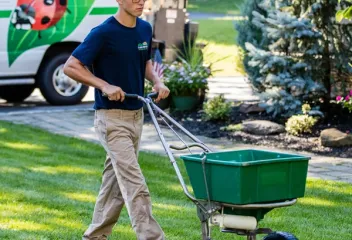 Dial Environmental lawn technician working a yard